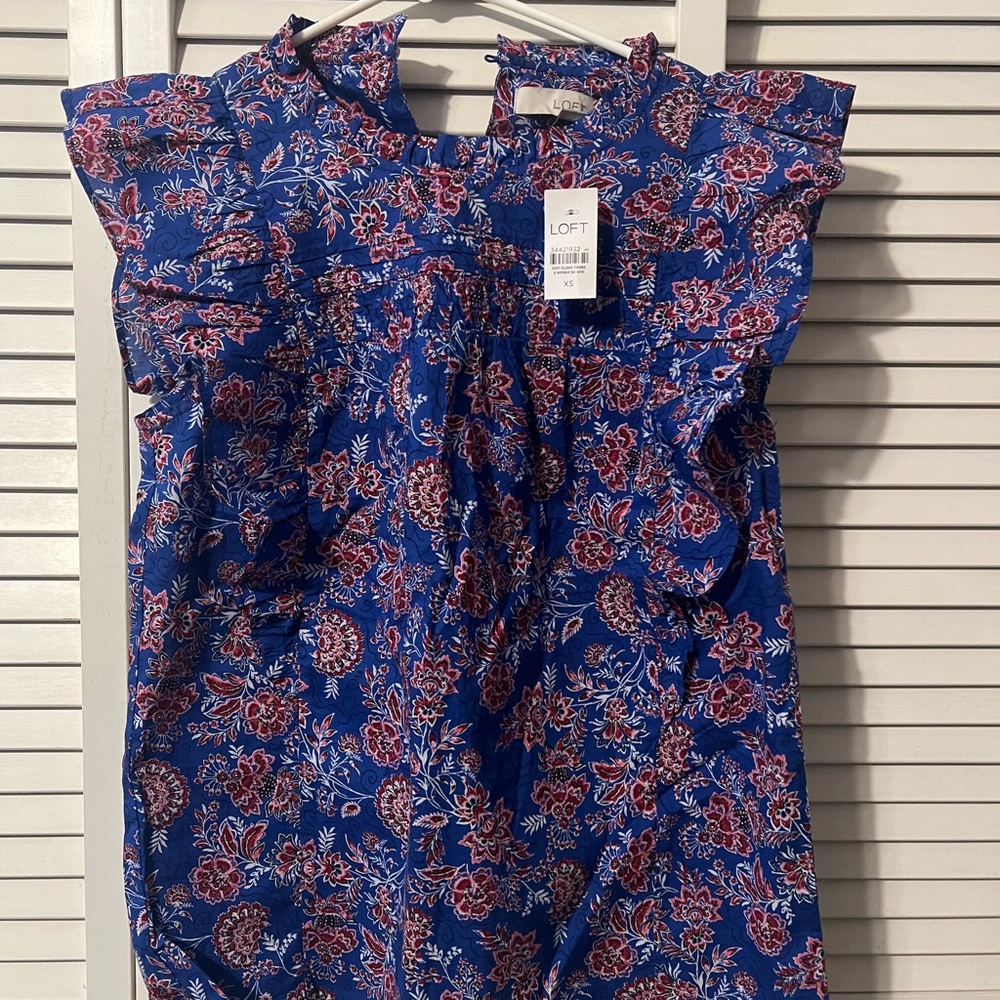 New w/tags Loft floral ruffle sleeve shirt. Bright blues and pinks.